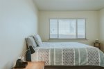 Upstairs first bedroom features a queen bed